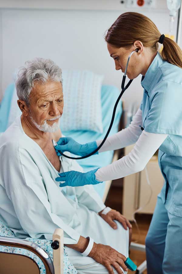 Doctor checking a patient's breathing.