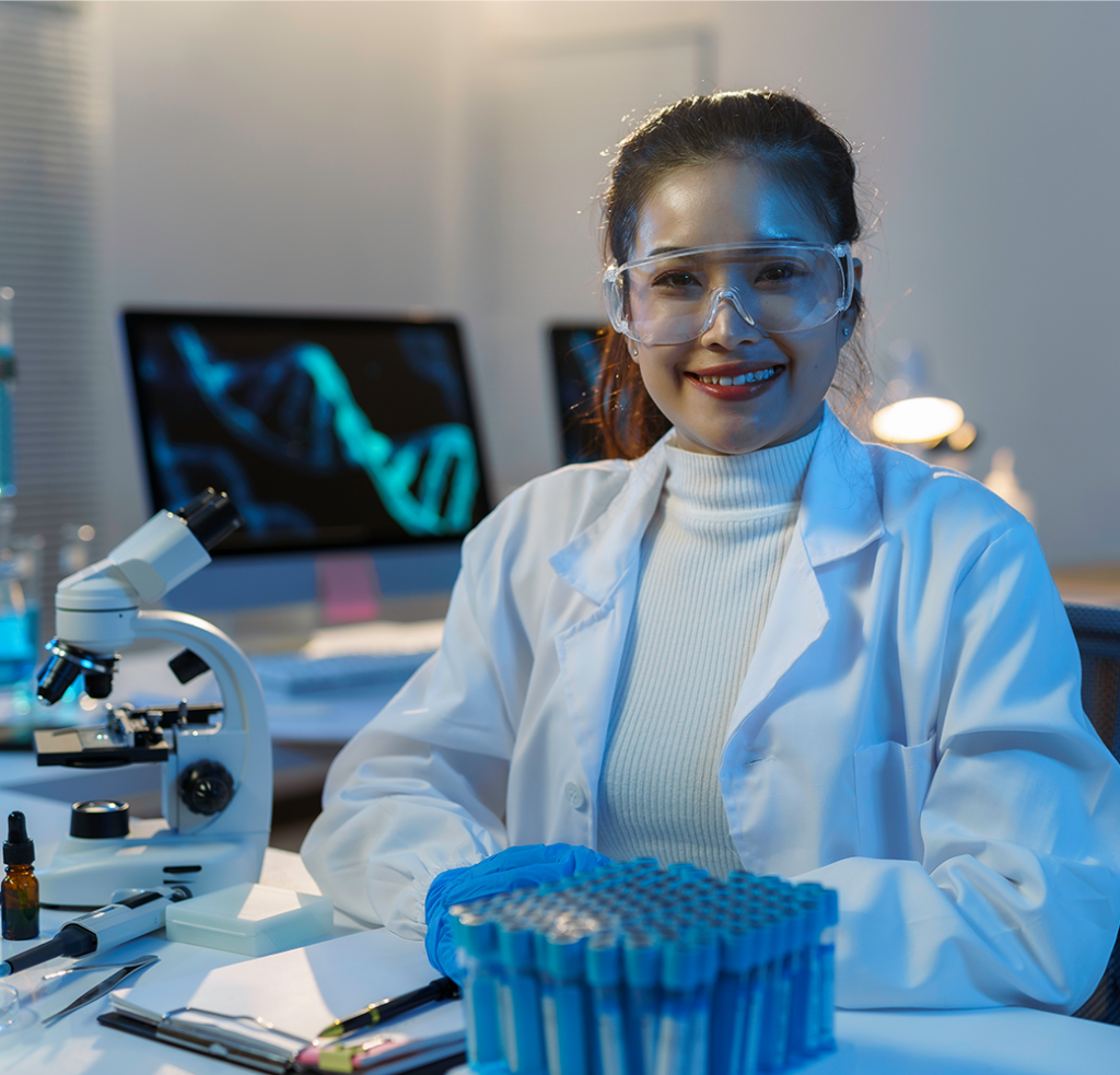 Doctor in a lab with viles and protective glasses.