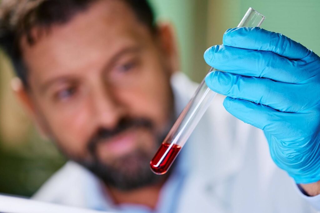 A close-up of a biochemist conducting regenerative medicine research in a laboratory setting.