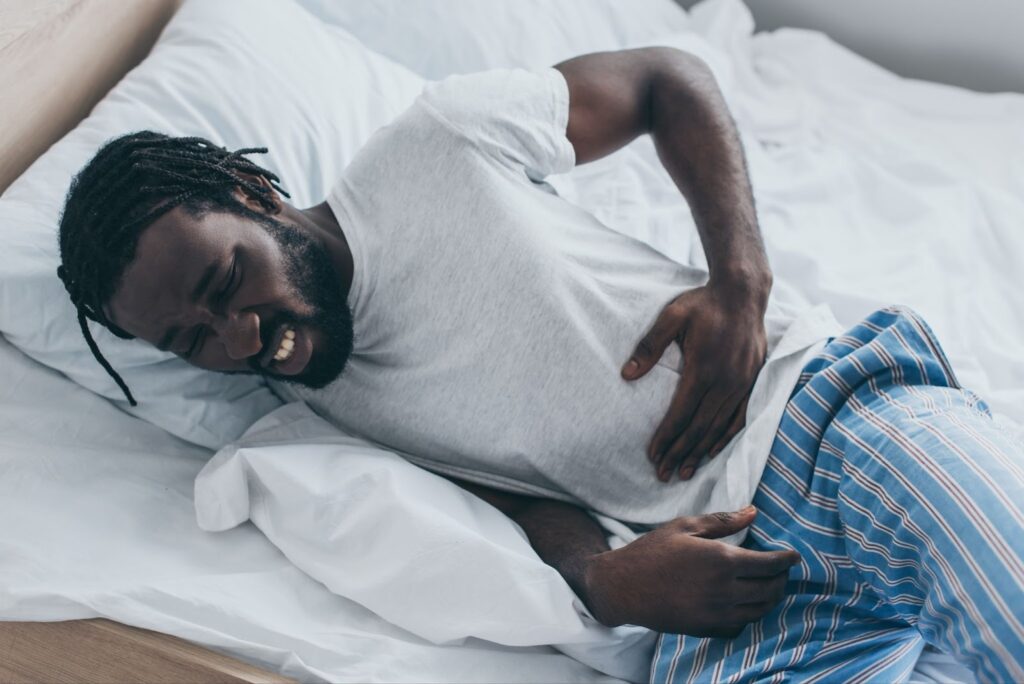 A man wakes up in the middle of the night due to pressure ulcer pain.